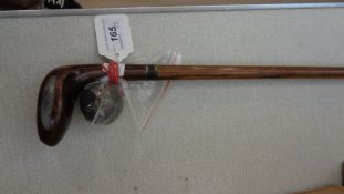 A golf club walking stick circa 1930, with an ash shaft,