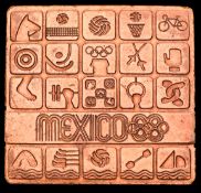 Mexico City 1968 Olympic Games participant's medal, designed by Lance Wyman, square form in copper,
