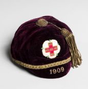 A red Yorkshire county representative cap awarded to H.