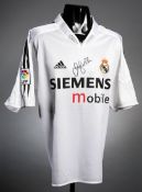 A David Beckham signed Real Madrid replica home jersey,