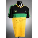 A Usain Bolt signed Jamaica athletics training top, by Puma in black, green & gold,