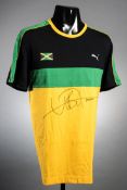 A Usain Bolt signed Jamaica athletics training top, by Puma in black, green & gold,