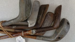 Six interesting putters, including a J H Taylor Model and an Orion,