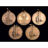 Five examples of the bronze 1930 World Cup commemorative medal,