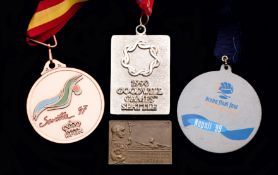 A group of four medals for aquatic sports,