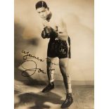 A fine Joe Louis signed photograph, the 9 by 6 1/2in.