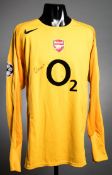 Jens Lehmann: a signed yellow Arsenal goalkeeping jersey circa 2005, signed in black marker pen,