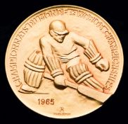 A gold first-place prize medal for the 1965 World Ice Hockey Championships in Tampere, Finland,