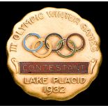 A rare Lake Placid 1932 Winter Olympic Games contestant's badge, gold-plated & enamel,