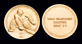 A gold first-place prize medal for the 1971 World Ice Hockey Championships in Switzerland & The