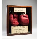 The gloves worn by Henry Cooper when he became the first boxer to put Cassius Clay down on the