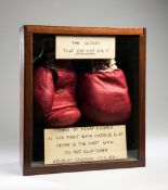 The gloves worn by Henry Cooper when he became the first boxer to put Cassius Clay down on the