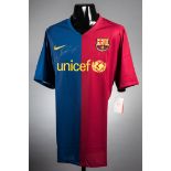 A Lionel Messi signed Barcelona replica home jersey,