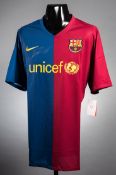 A Lionel Messi signed Barcelona replica home jersey,