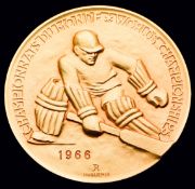 A gold first-place prize medal for the 1966 World Ice Hockey Championships in Yugoslavia awarded to