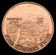 A 1968 Grenoble Winter Olympic Games participation medal, designed by M.