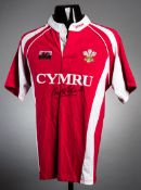 A Wales replica rugby shirt signed by Gareth Edwards,