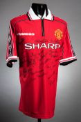 A Manchester United 1998-99 Treble Winning Season replica home jersey signed by Manchester United