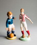 Two mid-20th century porcelain football figurines,