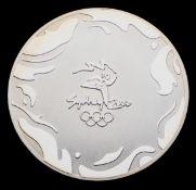 Sydney 2000 Olympic Games participant's medal, silvered metal, 50mm.