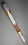 An Atlanta 1996 Olympic Games official bearer's torch, in aluminium and Georgia pecan wood,