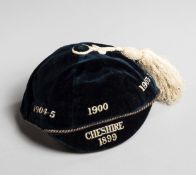 A navy blue Cheshire county rugby union representative cap awarded to L.