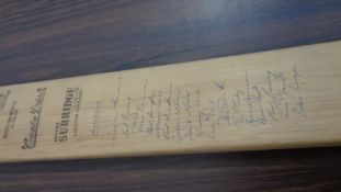 A cricket bat signed by the 1961 Australians, signed in ink to the face,