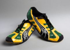 Usain Bolt signed trainers, both signed in silver marker pen,