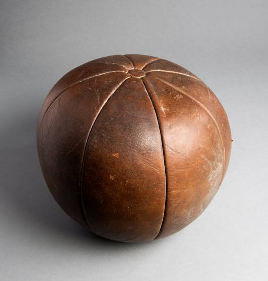 A 19th century leather gymnasium medicine ball, eight panels and button tops, diameter 30.5cm.