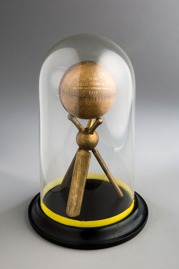 An 1878 presentation cricket ball, the ball inscribed gilt PRESENTED TO, Mr. J.