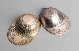 Two hallmarked silver jockey cap caddy spoons, one with a Birmingham hallmark, the other stamped .