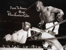 Photographs signed by the boxers Roberto Duran, Terry Downes and Rubin Carter,