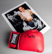 A Sir Henry Cooper signed boxing glove,