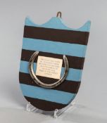 A racing plate worn by L'Escargot when winning the 1975 Grand National,