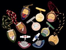 Ten groups of Sandown Park badges, one for each of the years 1960 to 1969, inclusive,