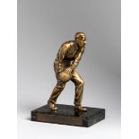 A continental bronze figure of a skittles player,