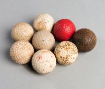Eight golf balls, including a square-mesh Redwing golf ball circa 1925, three Kro Flites, a Goblin,