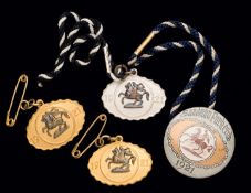 A group of four 1921 Sandown Park badges,