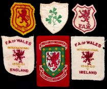 A group of six Alf Sherwood international shirt badges, four Wales badges in three separate styles,