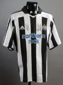 Newcastle United replica jersey signed by Sir Bobby Robson and Alan Shearer,