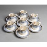 Seven porcelain coffee cups & saucers bearing the crest of the Jockey Club,