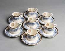 Seven porcelain coffee cups & saucers bearing the crest of the Jockey Club,