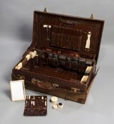 The travelling case of the jockey Steve Donoghue, vintage crocodile skin case,