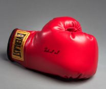 A Muhammad Ali signed boxing glove, a right-hand red Everlast glove,