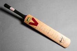 A cricket bat signed by twelve bowlers who have taken over 300 Test wickets,