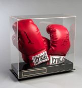 Muhammad Ali & George Foreman signed boxing gloves, a pair of red Everlast gloves,