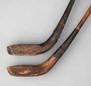 Two scared-neck golf clubs by Andrew Sommerville circa 1900, a driver and a putter,