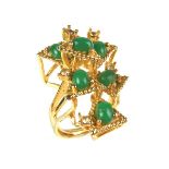 Gold plated chrysoprase ring. Of abstract form set with seven oval chrysoprase cabochons.