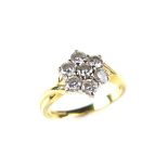 18 ct yellow gold diamond flower cluster ring. Set with seven round brilliant cut diamonds.