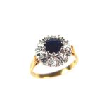 18 ct yellow gold sapphire and diamond ring. The circular cut sapphire weighing approx. 1.